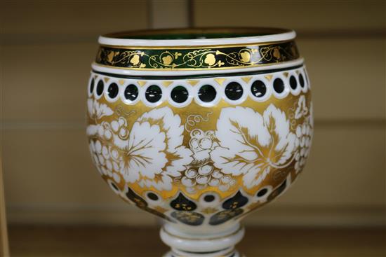 A late 19th century Bohemian white and green overlaid cut glass standing cup H24.5cm